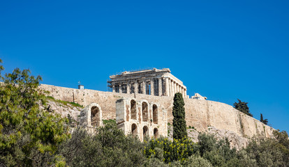 Acropolis of Athens Greece rock and Parthenon on blue sky background, sunny day.