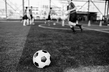 Fototapeta premium black and white picture of football on artificial turf