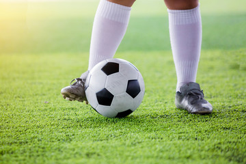 boy soccer player jogging and  control ball