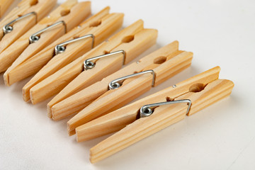 Wooden clips for attaching washed underwear on a string. Old natural home accessories.