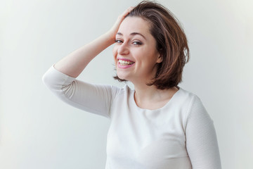 Happy girl smiling. Beauty portrait young happy positive laughing brunette woman on white...