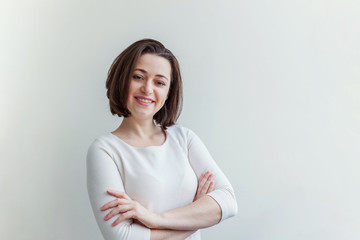 Happy girl smiling. Beauty portrait young happy positive laughing brunette woman on white...