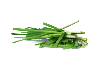 Fresh leeks leaves isolated on white background