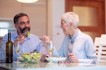 Senior couple havihg lunch at home