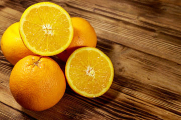 Fototapeta na wymiar Fresh oranges on wooden table
