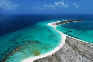 Caribbean sea, Los Roques, Venezuela: vacation on the blue sea and paradisiac beach. Vacation travel. Travel destination. Tropical travel. Great beach scenery. Beautiful landscape.