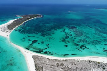 Obraz premium Caribbean sea, Los Roques, Venezuela: vacation on the blue sea and paradisiac beach. Vacation travel. Travel destination. Tropical travel. Great beach scenery. Beautiful landscape.