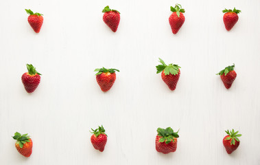 Fresh strawberries pattern on a white background.
