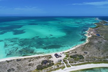 Caribbean sea, Los Roques, Venezuela: vacation on the blue sea and paradisiac beach. Vacation travel. Travel destination. Tropical travel. Great beach scenery. Beautiful landscape.