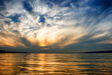 Lake Balaton in golden colors after sunset with a nice cloudscape in Hungary
