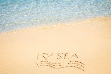 Beautiful drawing on the sand of the sea background