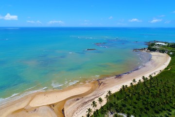 Aerial view of Cumuruxatiba Beach, Prado, Bahia, Brazil. Great landscape. Beautiful beach and river sceneries. Tropical travel. Travel Destination. Vacation travel. Nature scenery.