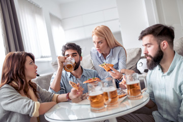 Group of friends enjoying pizza
