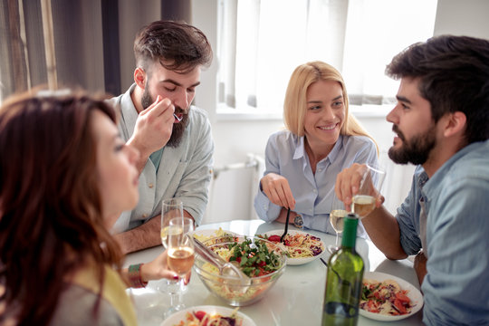 Friends having lunch together at home