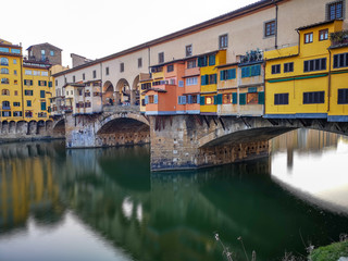 Fototapeta na wymiar florence,tuscany/Italy 24 february 2019 : the ponte vechio ,the most famous landmark of the city,thousands of people are crossing this bridge every day