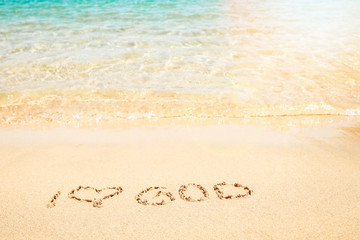 Beautiful drawing on the sand of the sea background