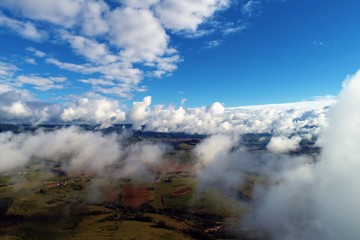 Sun above clouds with a blue sky. Fantastic landscape. Peace, Freedom, overcoming, inspirational, God. Great sky view! Drone flying above clouds. Sunrise view. 
