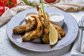 fried sprat on plate