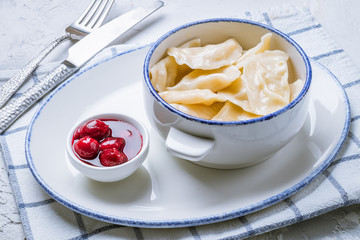 dumplings with cherries on a plate