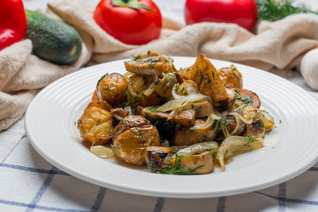 Fried potatoes with mushrooms