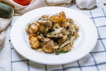 Fried potatoes with mushrooms