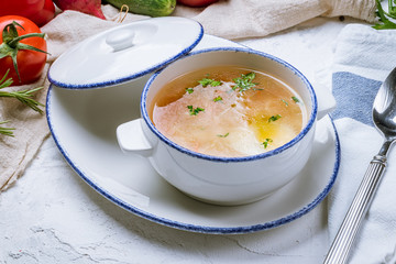 Chicken soup bouillon in a plate