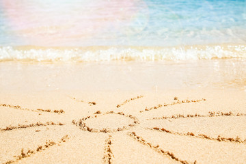 Beautiful drawing on the sand of the sea background