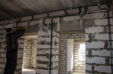 Installation of electrical wiring in the room, the beginning of interior work
