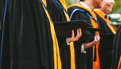 Close up Graduate holding a hat. Concept success education in University.