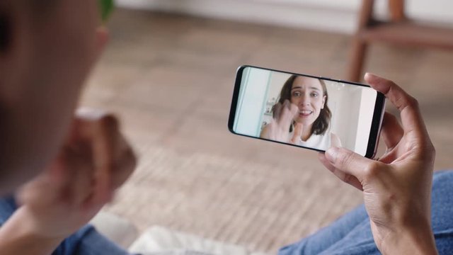 deaf woman woman using smartphone video chatting with best friend communicating with sign language hand gestures enjoying online communication