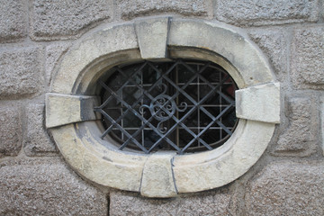 Oval Window in Stone Facade