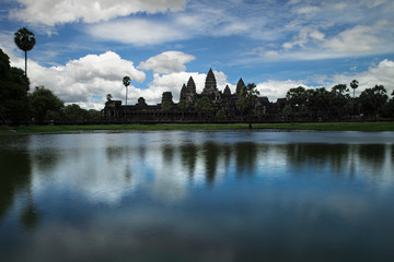 Fototapeta na wymiar Angkor Wat and cloudy sky reflected in the water in Siem Reap, Cambodia