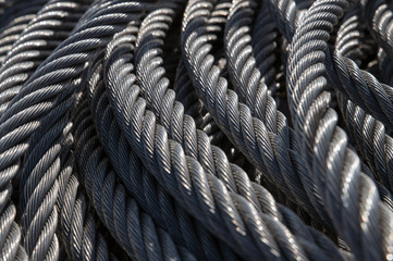 Closeup view of new clean steel rope or steel cable. Industrial wire texture.