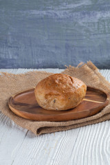 close up of white bread bun on plate