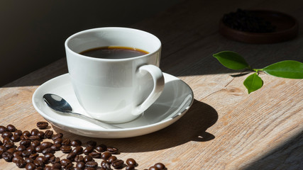 coffee in white cup on wooden table