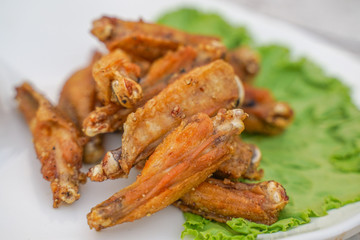 closeup of homemade fried chicken wings on plate