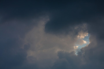 Naklejka na ściany i meble dark heavy storm cloud on dramatic moody sky
