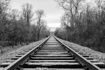 Fototapeta na wymiar Black and white rail road tracks.