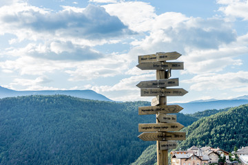 Alpe di Siusi, Seiser Alm with Sassolungo Langkofel Dolomite, a signpost in kastelruth