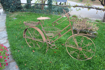 Fototapeta na wymiar decorative metal bike in park