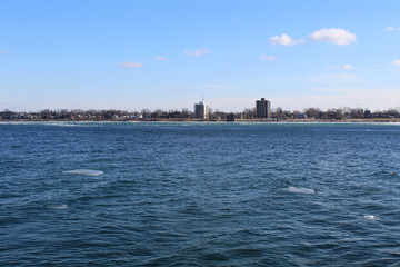 Detroit River in winter with Windsor, Canada in background