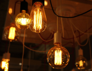 Ceiling lamps on dark background in store