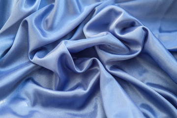 Fabric blue waves - material for background and texture.