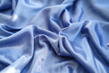 Fabric blue waves - material for background and texture.