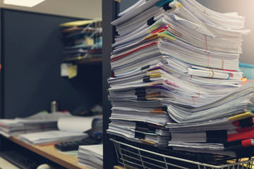 Business and finance concept of office working, Pile of unfinished documents on office desk, Stack of business paper