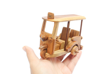Wooden Tuk Tuk  Taxi model. Three-Wheels on isolated photo