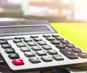 Close up button calculator , calculator on paper messy and cluttered office desk