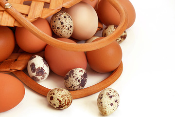 Easter. Easter eggs lie in a basket, on a light background. Selective focus, macro, toning, blur.