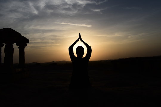silhouette of woman at sunset
