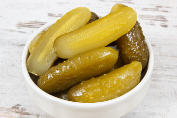 Fresh homemade pickled cucumbers in white bowl